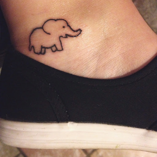 Simple Black Outline Baby Elephant Tattoo On Ankle