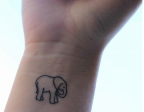 Simple Black Outline Baby Elephant Tattoo On Wrist