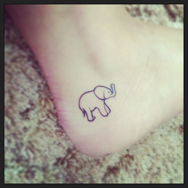 Simple Black Outline Elephant Tattoo On Ankle