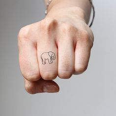 Simple Black Outline Elephant Tattoo On Finger