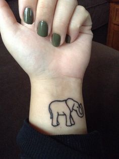 Simple Black Outline Elephant Tattoo on Girl Left Wrist