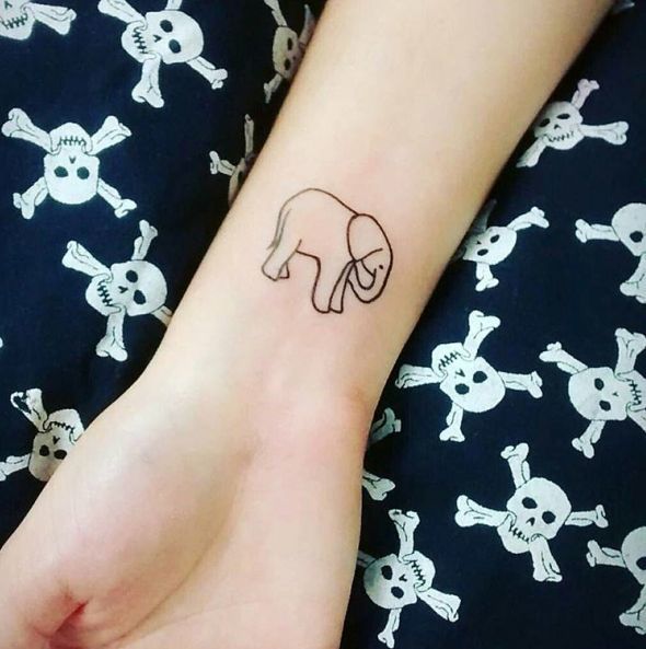 Simple Black Outline Small Baby Elephant Tattoo On Wrist