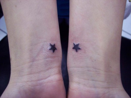 Small Black Star Tattoos On Both Wrists
