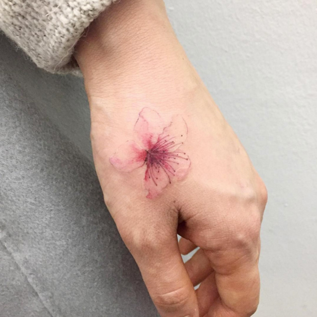 Small Cherry Blossom Tattoo On Left Hand
