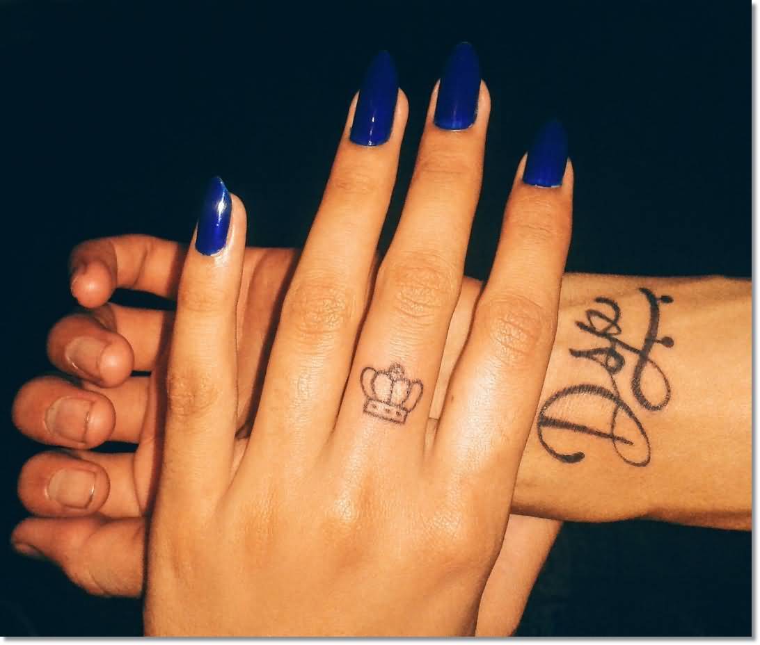 Small Crown Tattoo On Girl Middle Finger