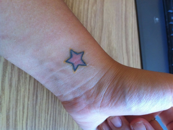 Small Red Star Tattoo On Wrist For Men