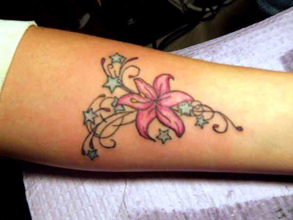 Stars And Pink Lily Flower Tattoo On Wrist