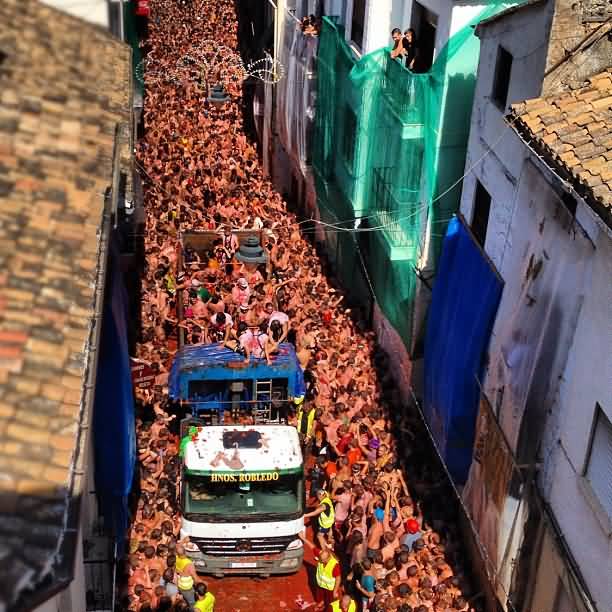 Streets Of Bunol Gathered With People Celebrating La Tomatina Festival