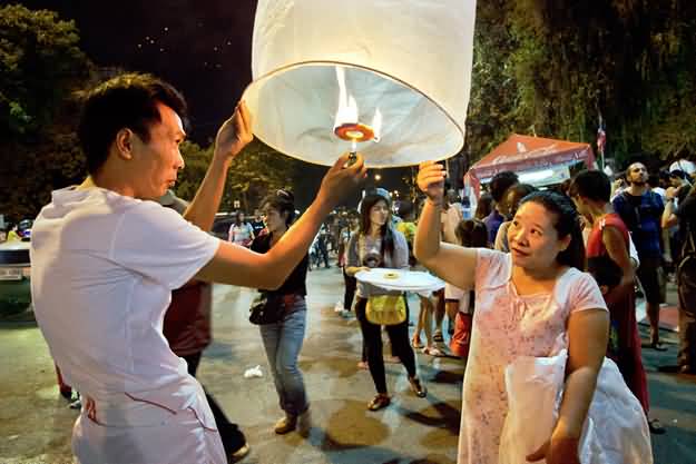 Thai People Celebrating Yi Peng Festival
