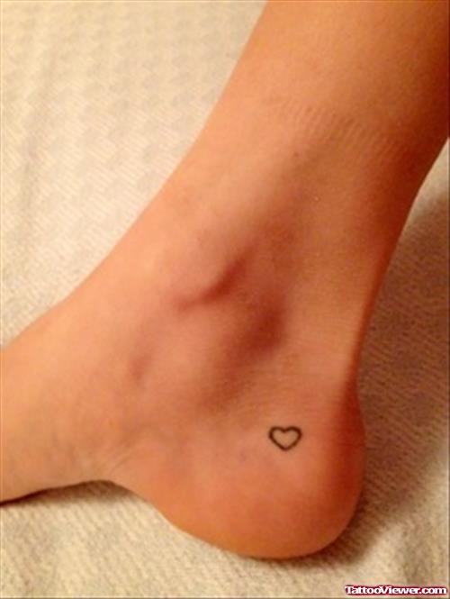Tiny Heart Outline Tattoo On Ankle