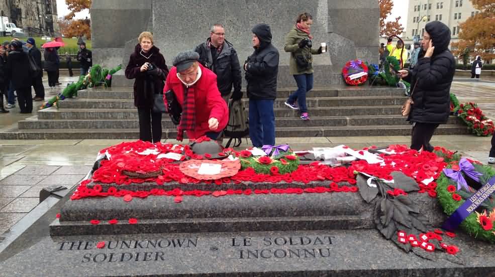 Tomb Of The Unknown Soldier Covered With Poppy Flowers During Remembrance Day Ceremony
