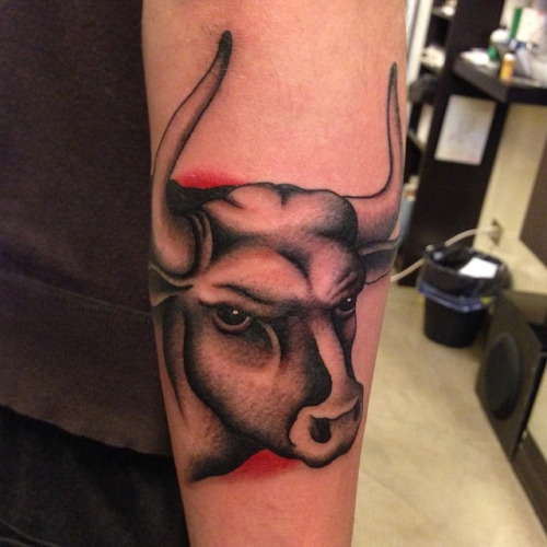 Traditional Calm Face Bull Tattoo On Arm Sleeve