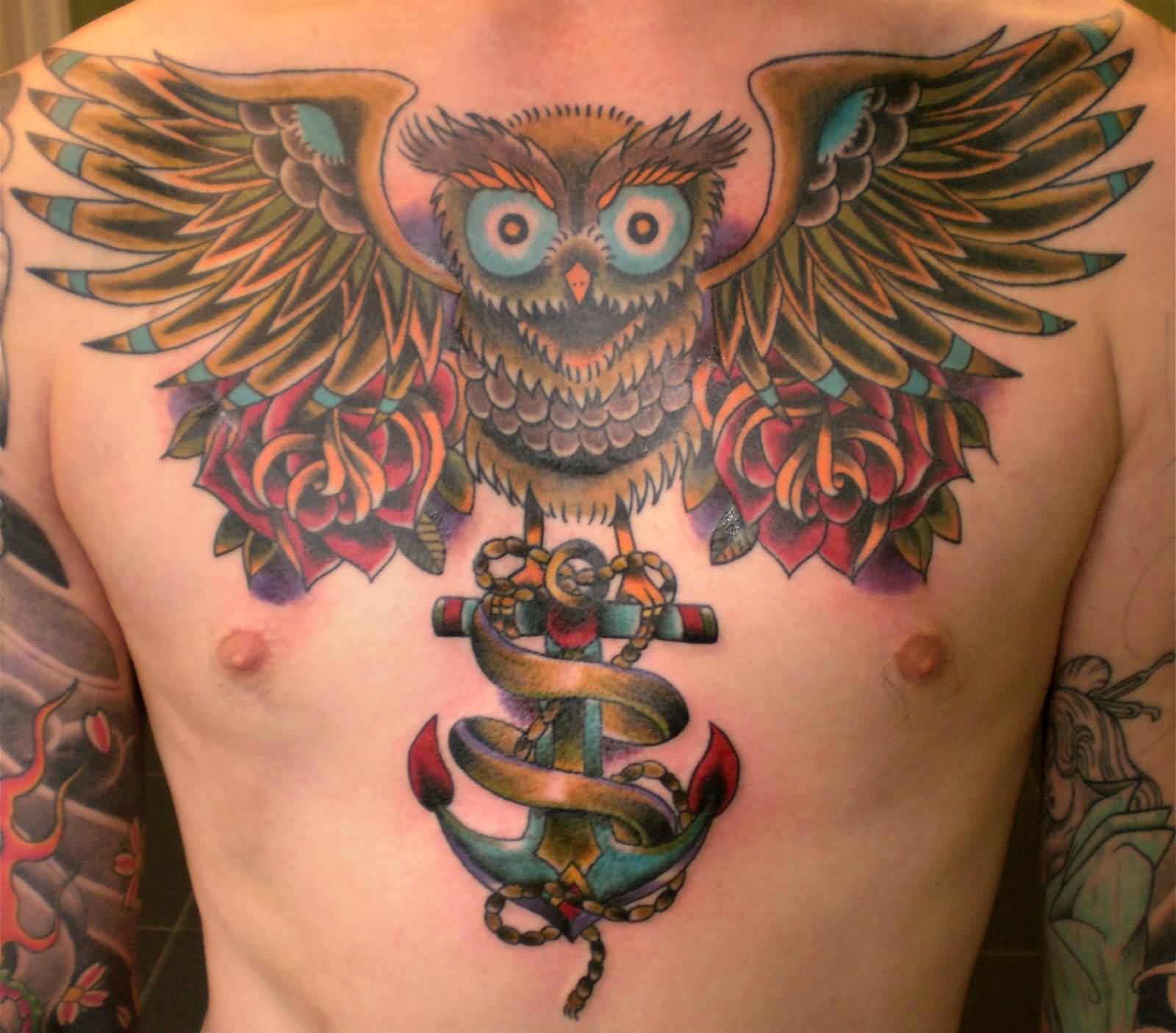 Traditional Roses And Flying Owl Tattoo On Man Chest