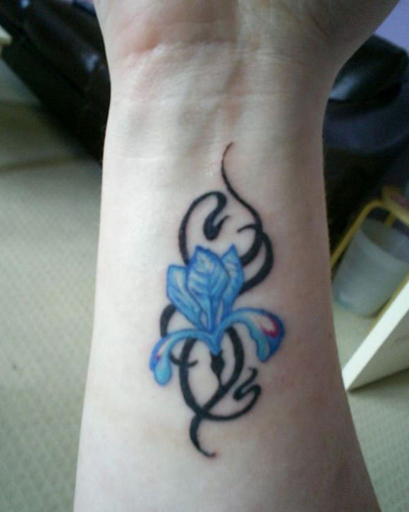 Tribal And Blue Flower Wrist Tattoo