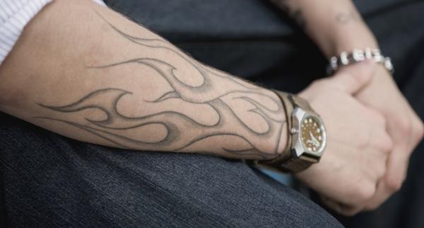 Tribal Flames Tattoo On Wrist For Men