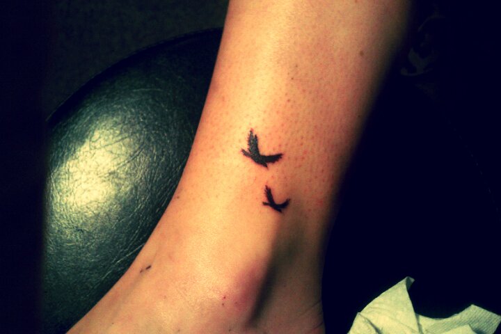 Two Black Birds Flying Tattoo On Ankle