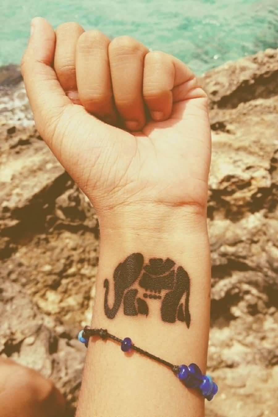Unique Black Ink Elephant Tattoo On Left Wrist
