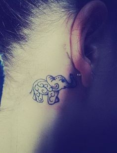 Unique Elephant Trunk Up Tattoo On Girl Right Behind The Ear