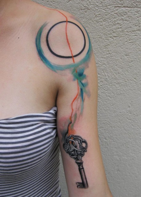 Unique Watercolor Zen Circle With Key Tattoo On Girl Left Shoulder