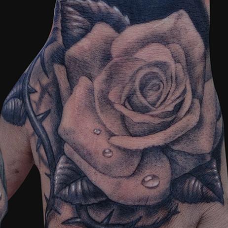 Water Drops And Grey Rose Tattoo On Left Hand