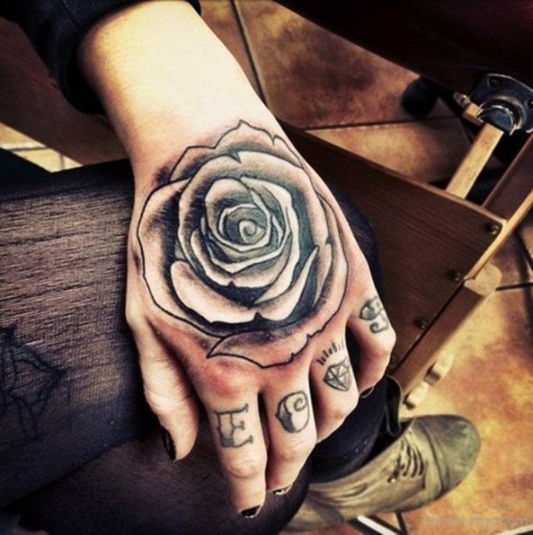 White And Black Rose Tattoo On Girl Left Hand