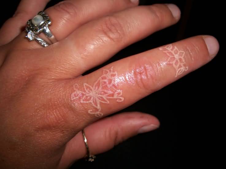 White Ink Flowers Tattoo On Side Finger
