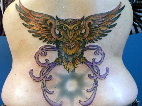 Yellow Ink Flying Owl Tattoo On Back