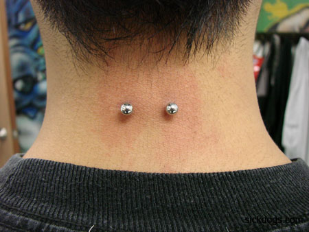 Amazing Back Neck Piercing With Silver Barbell