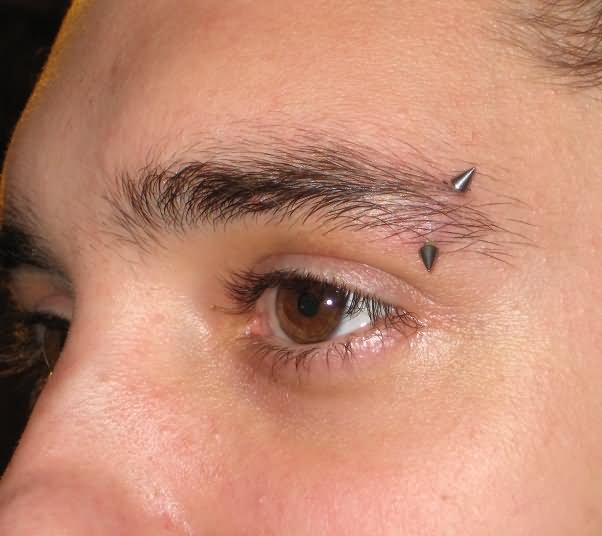 Amazing Eyebrow Piercing With Curved Spike Barbell