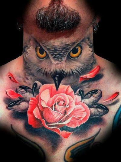 Amazing Owl Face With Rose Tattoo On Man Neck