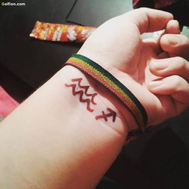 Aquarius With Sagittarius Zodiac Sign Tattoo On Left Wrist
