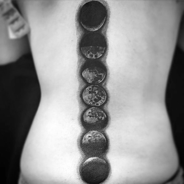 Attractive Black Ink Phases Of The Moon Tattoo On Spine