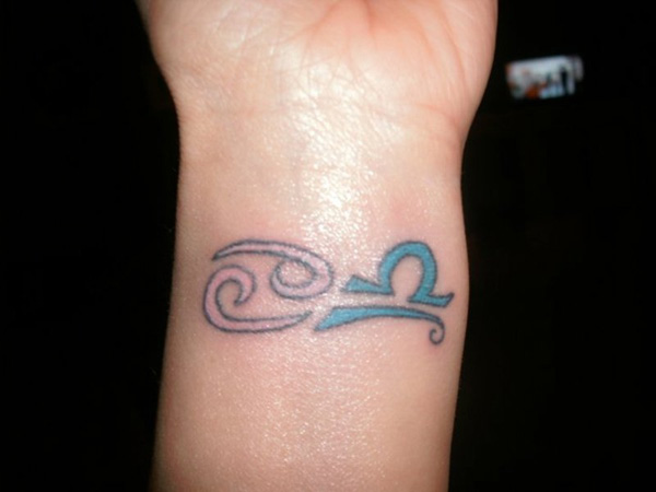 Attractive Cancer And Libra Zodiac Sign Tattoo On Left Wrist