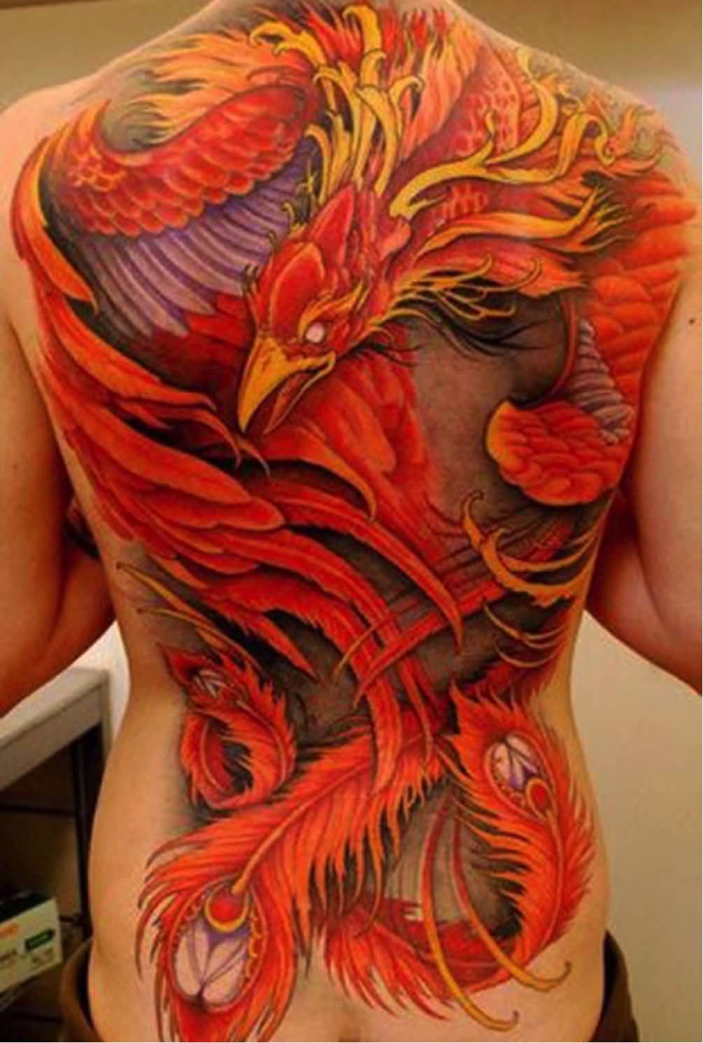 Attractive Colorful Phoenix Tattoo On Man Full Back