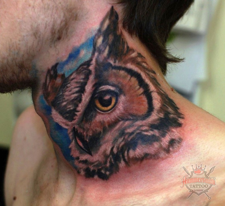 Attractive Owl Face Tattoo On Man Side Neck