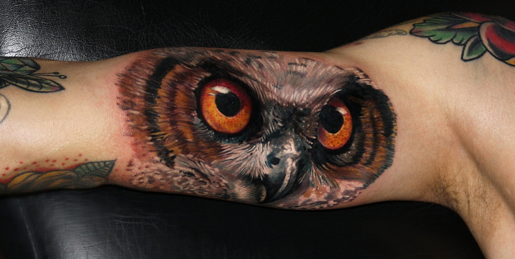Attractive Owl Face Tattoo On Right Bicep