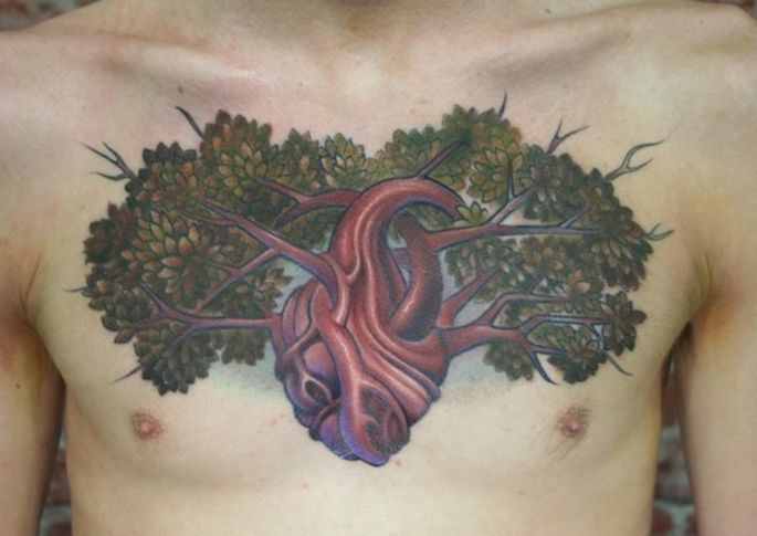Attractive Real Heart Tree Of Life Tattoo On Man Chest