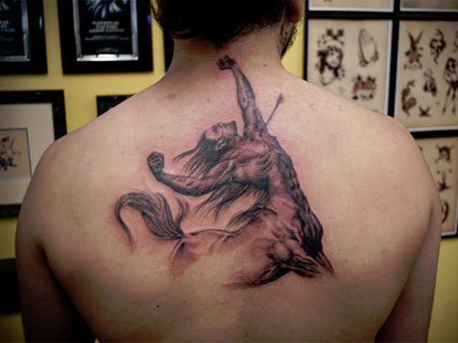 Awesome Black Ink Sagittarius Zodiac Sign Tattoo On Man Upper Back
