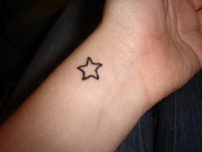 Awesome Black Star Tattoo On Left Wrist