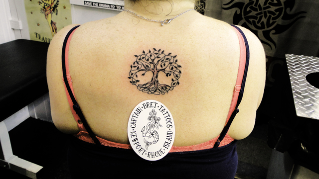 Awesome Celtic Tree Of Life Tattoo On Girl Upper Back