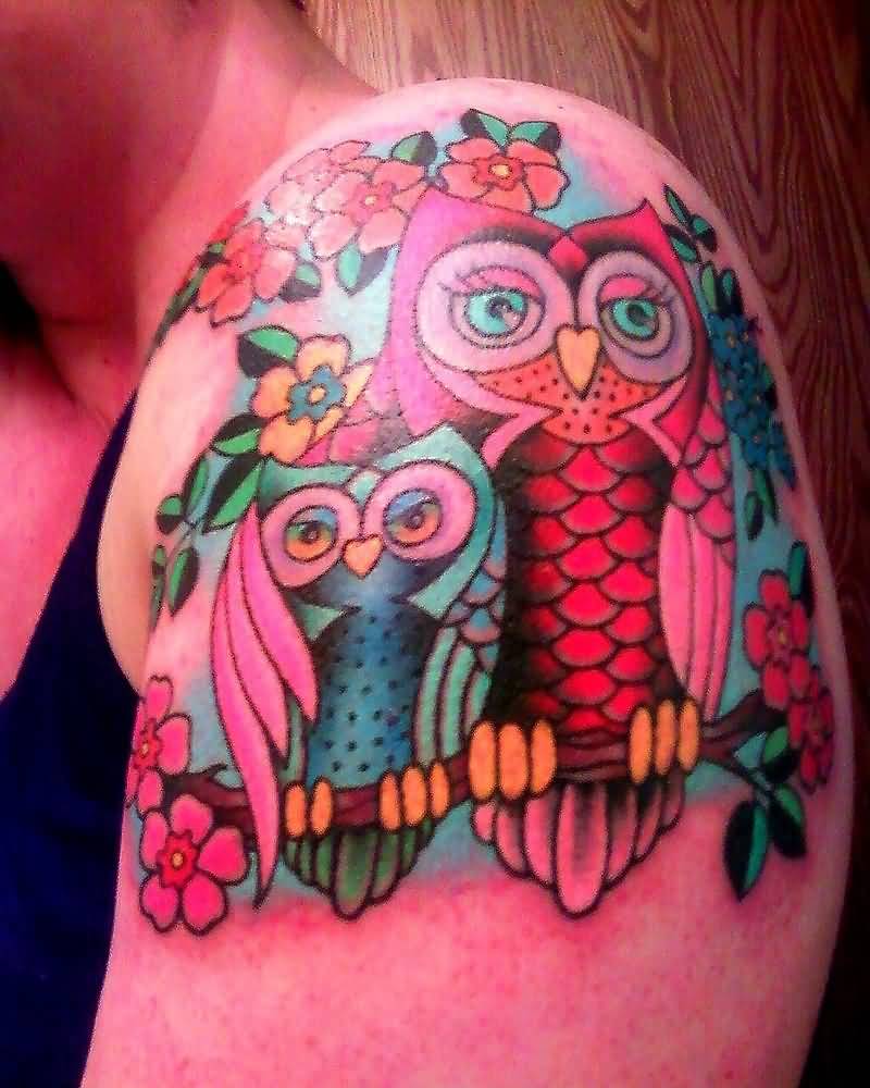 Awesome Colorful Owl Family On Branch With Flowers Tattoo On Left Shoulder