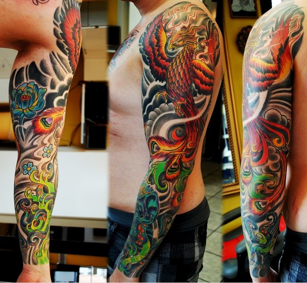 Awesome Colorful Phoenix Tattoo On Man Left Full Sleeve