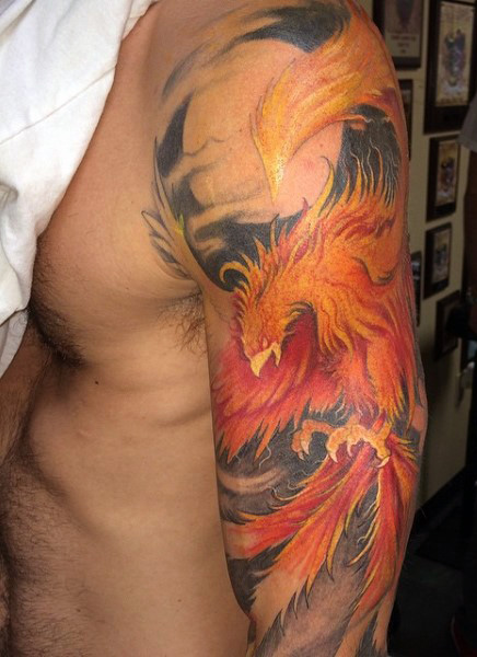 Awesome Colorful Phoenix Tattoo On Man Left Upper Arm