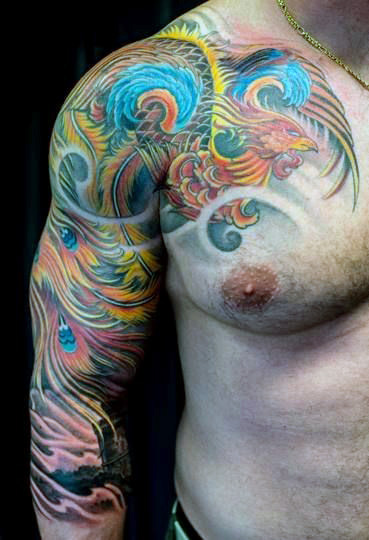 Awesome Colorful Phoenix Tattoo On Man Right Shoulder