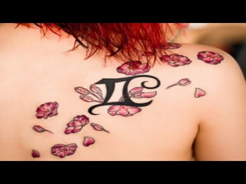Awesome Gemini Zodiac Sign With Flowers Tattoo On Girl Right Back Shoulder