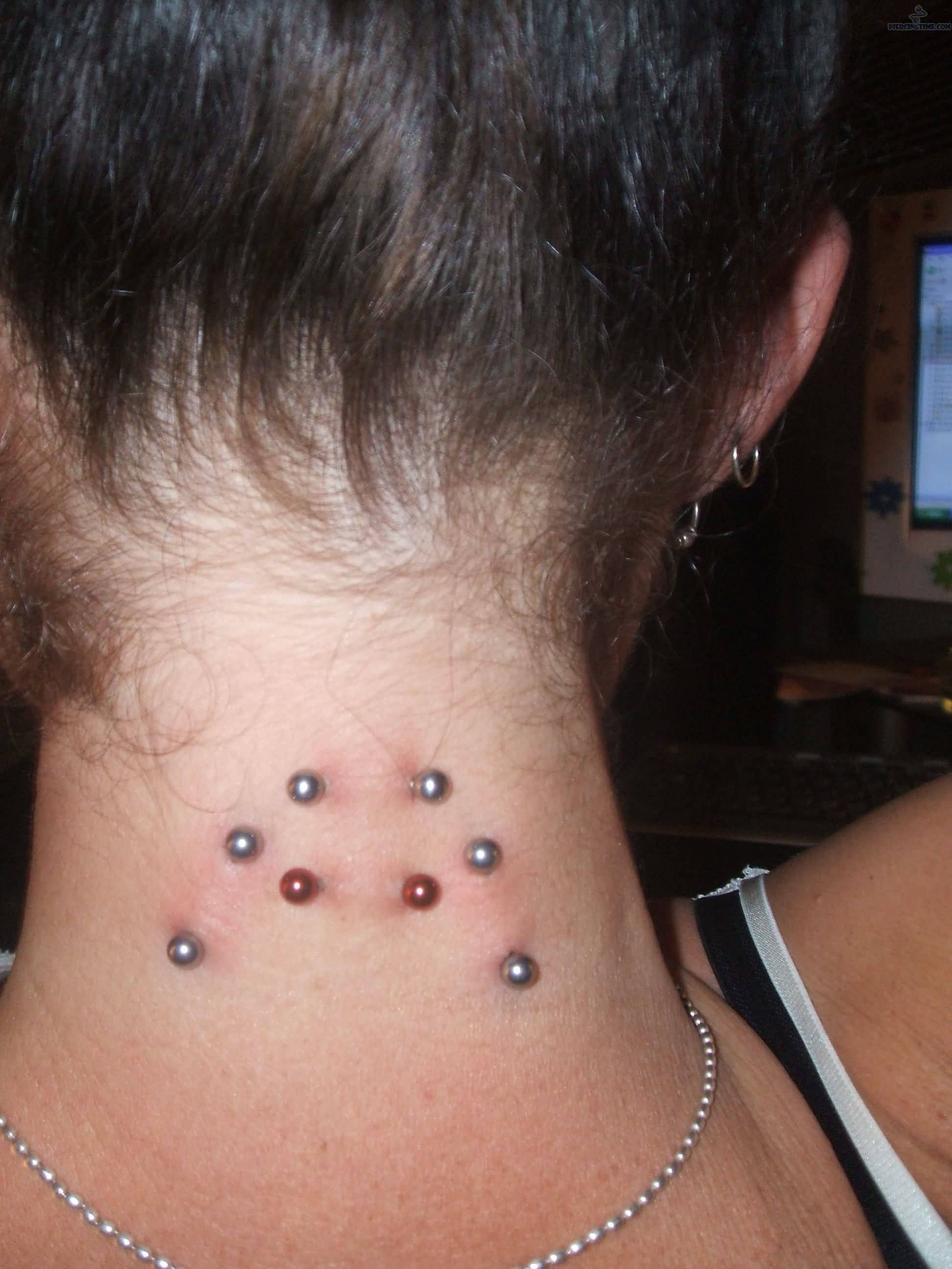 Back Neck Piercing Silver And Red Barbells