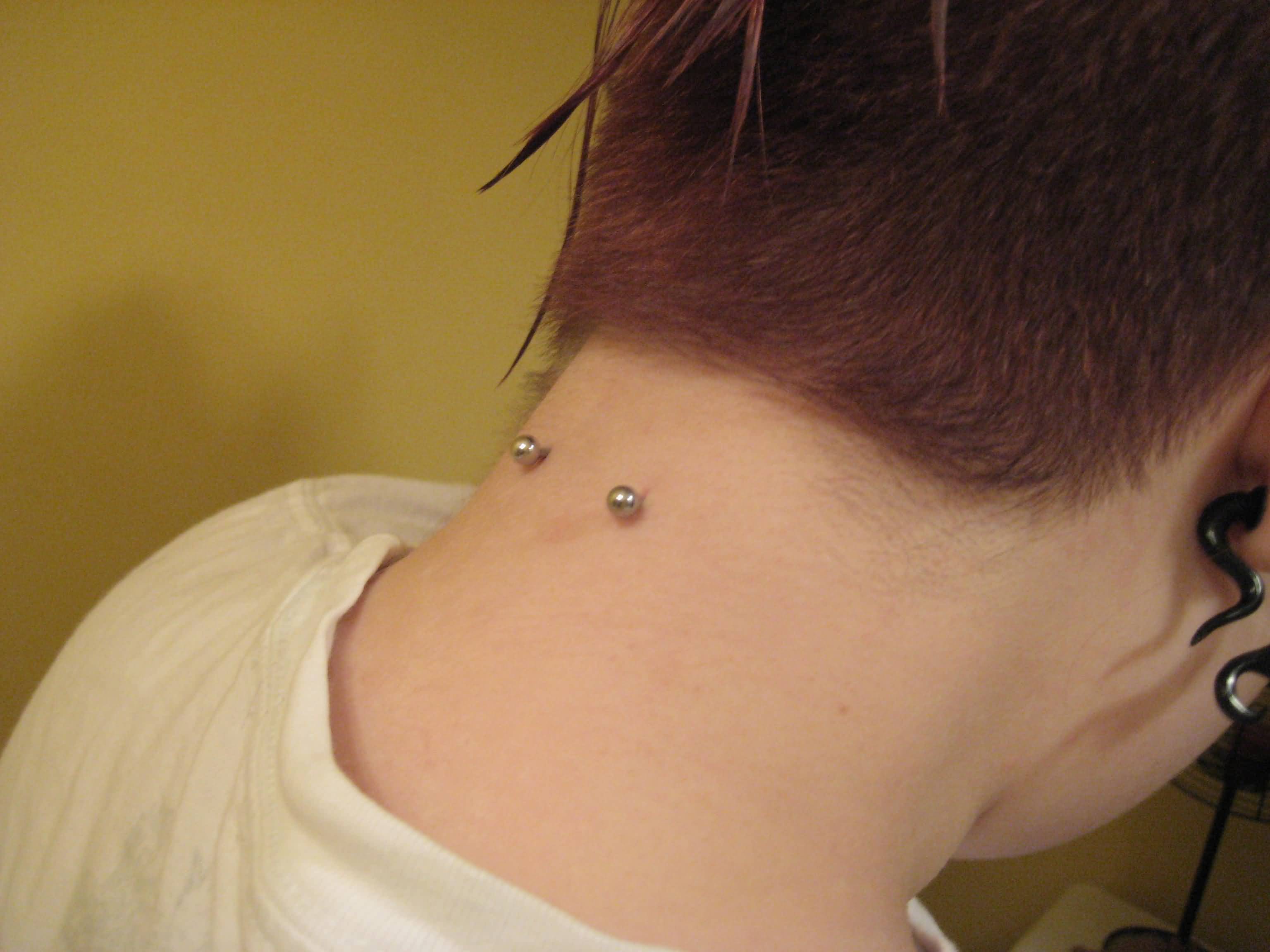 Back Neck Piercing With Silver Studs