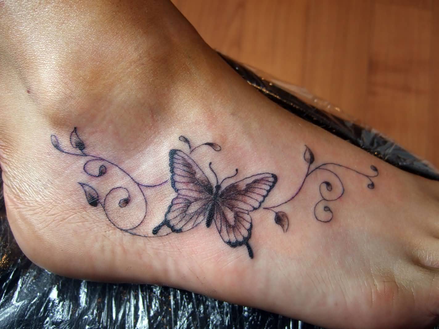 Black And Grey Butterfly Foot Tattoo