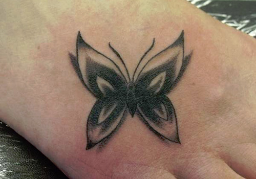 Black And Grey Butterfly Tattoo On Right Foot