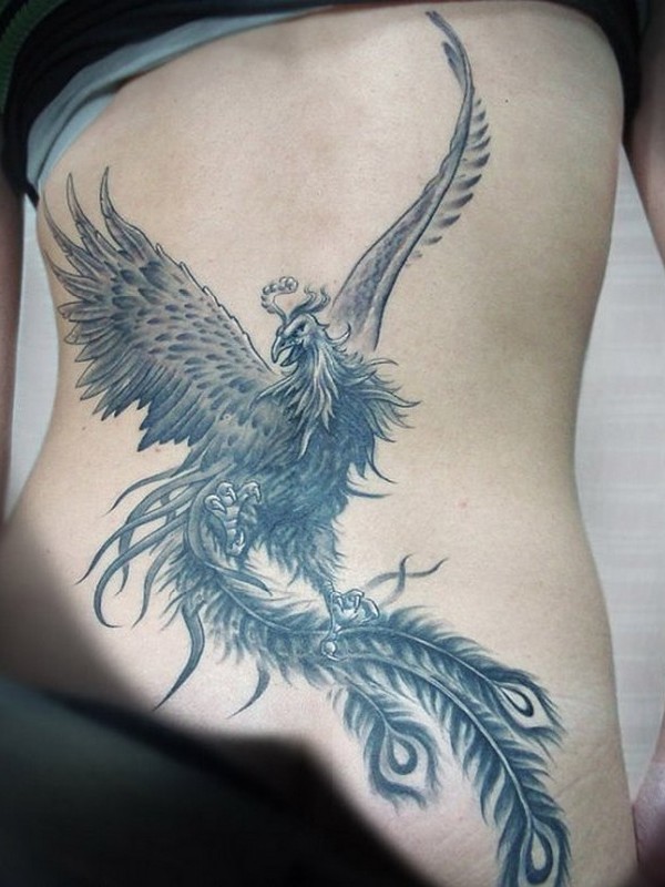 Black And Grey Flying Phoenix Bird Tattoo On Lower Back